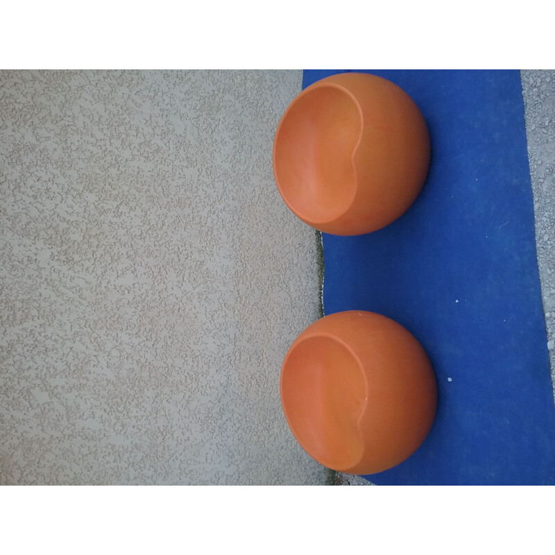 Pair of vintage orange plastic pouffes