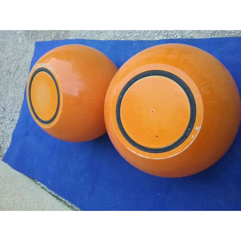 Pair of vintage orange plastic pouffes