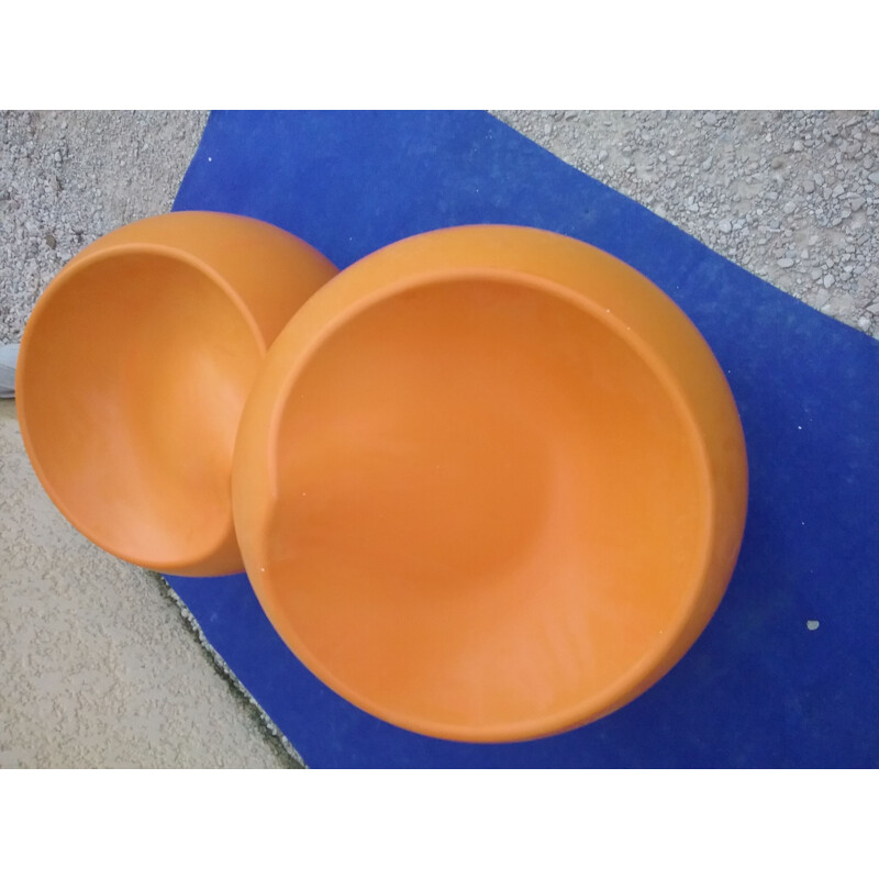 Pair of vintage orange plastic pouffes