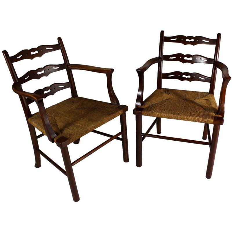 Pair of vintage oak dining chairs with woven rush seat from the first half of  20th century