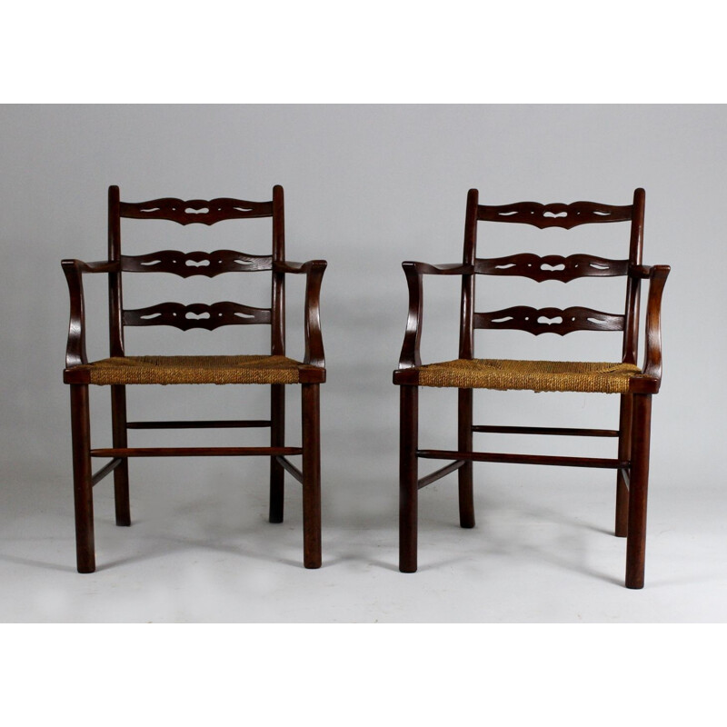 Pair of vintage oak dining chairs with woven rush seat from the first half of  20th century