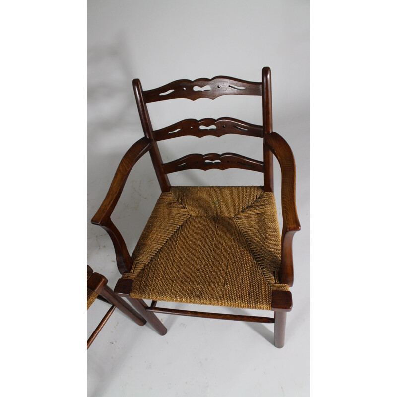 Pair of vintage oak dining chairs with woven rush seat from the first half of  20th century