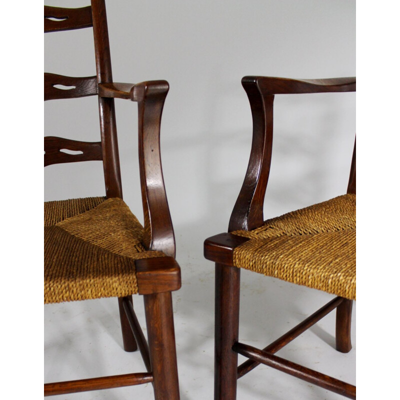 Pair of vintage oak dining chairs with woven rush seat from the first half of  20th century