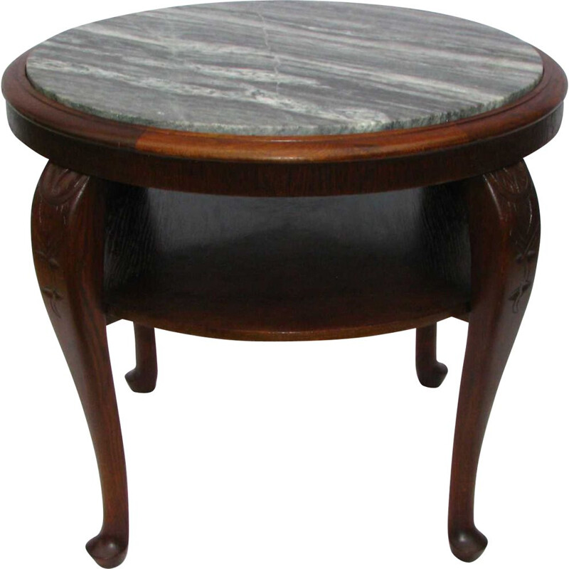 Table vintage avec plateau en marbre sur des pieds pliés