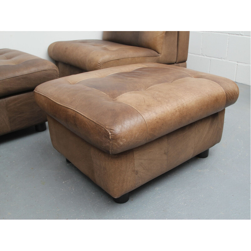 Pair of vintage buffalo leather armchairs and footrests, 1970