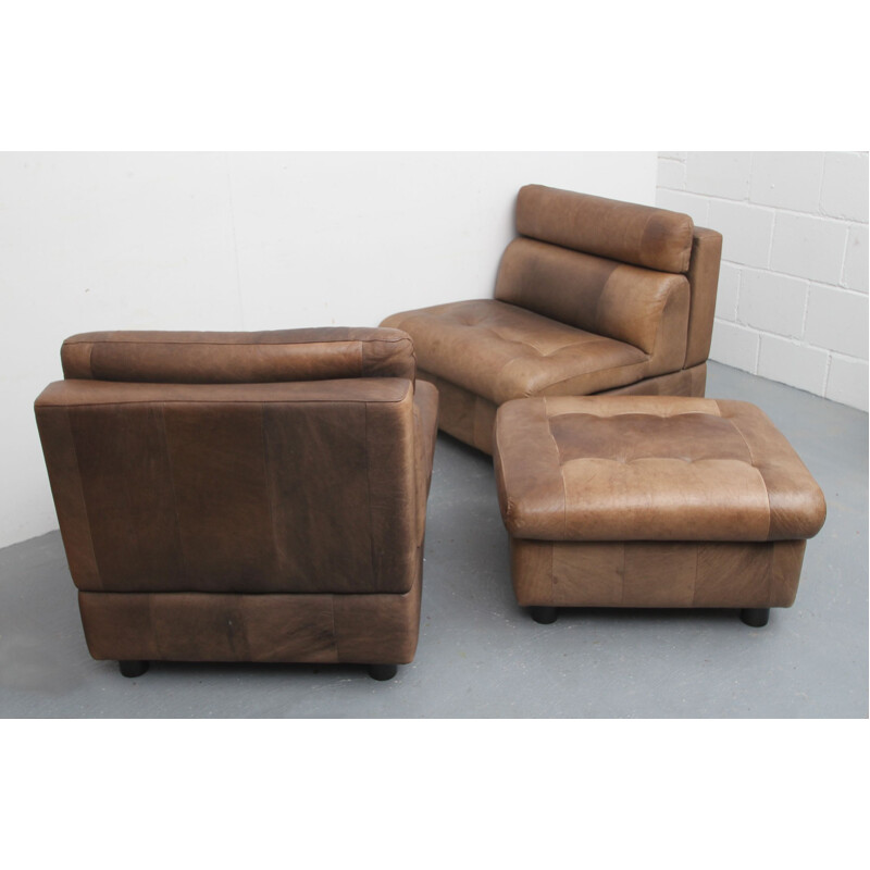 Pair of vintage buffalo leather armchairs and footrests, 1970