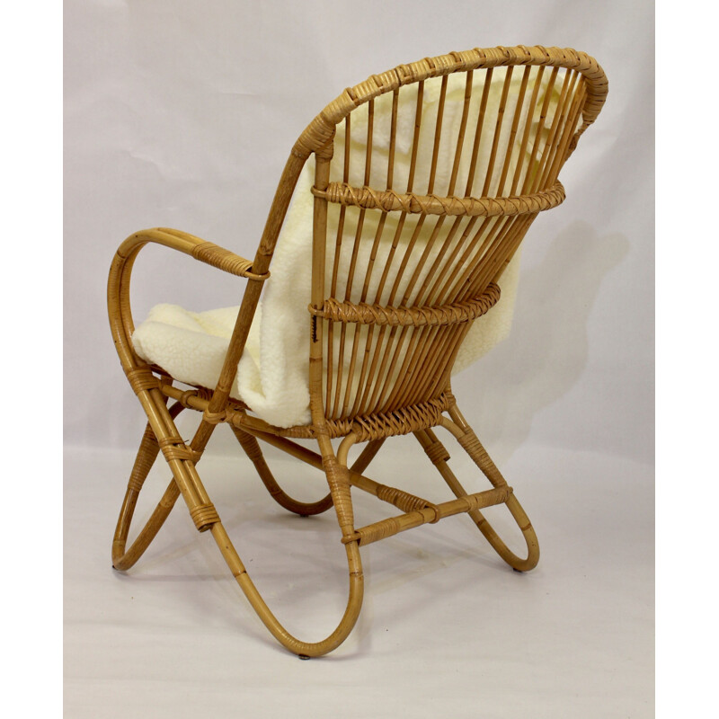 Vintage rattan armchair with butterfly feet 1960