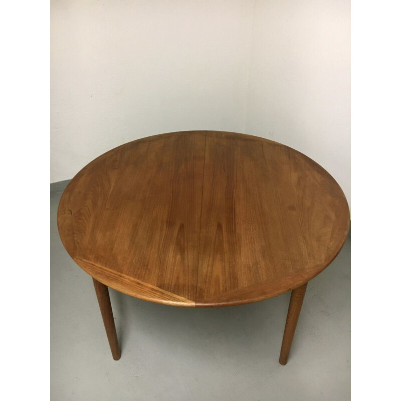 Vintage teak dining table with extension leaf