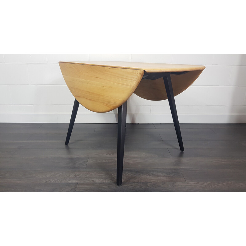 Table à manger Vintage Drop Leaf Ercol Round Black Leg 1960