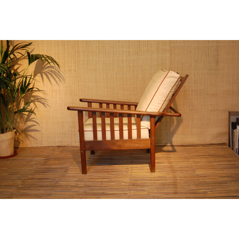 Mid-century colonial style armchair in solid teak and raffia - 1950