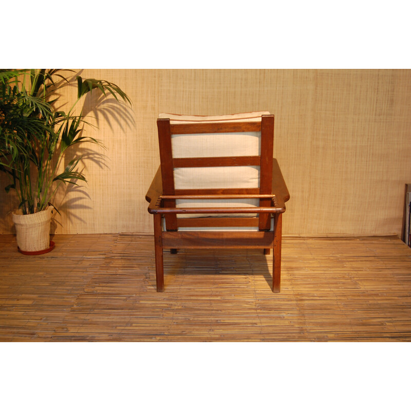 Mid-century colonial style armchair in solid teak and raffia - 1950