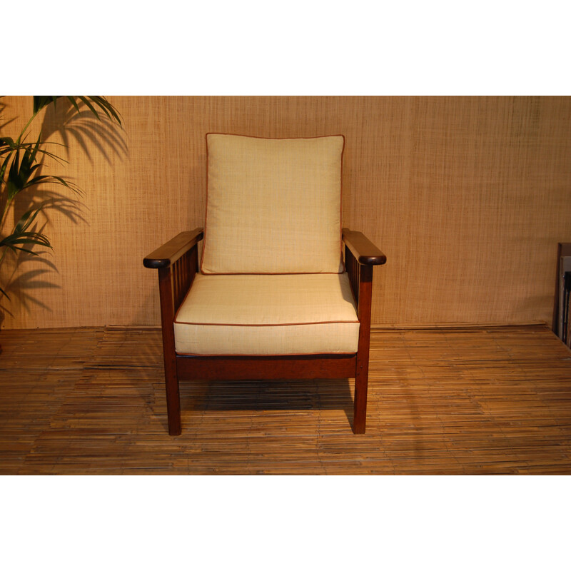 Mid-century colonial style armchair in solid teak and raffia - 1950