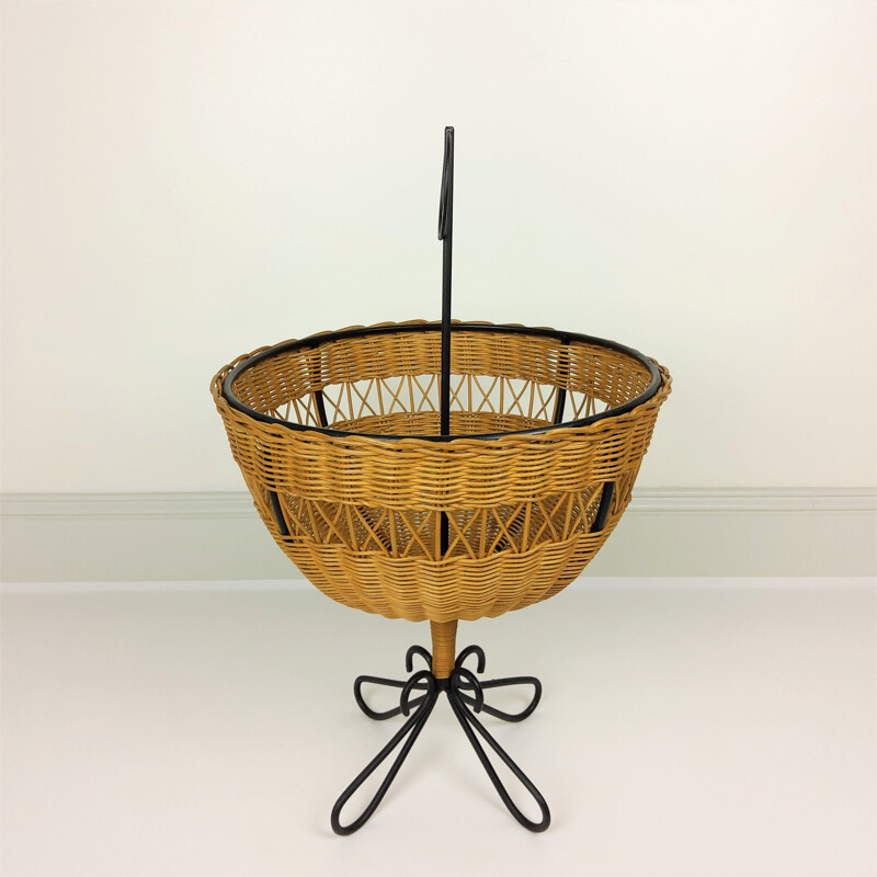 Vintage rattan basket on 4 black lacquered metal legs, 1950