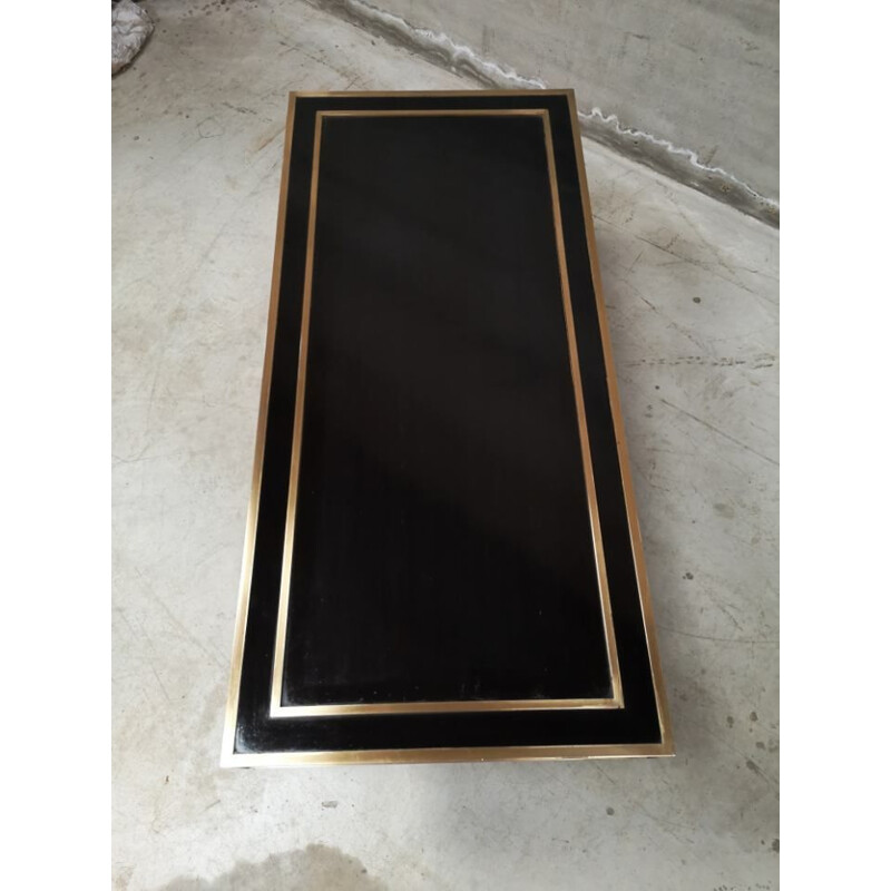 Vintage coffee table in brass and black lacquer by Jean-Claude Mahey, 1970