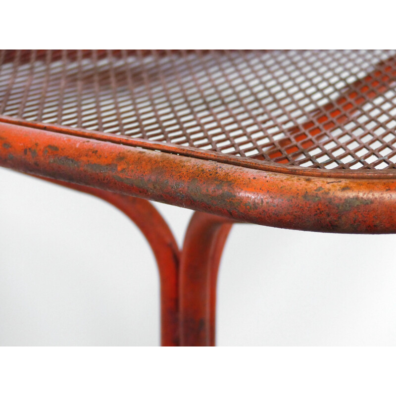 Vintage industrial orange saddle table 