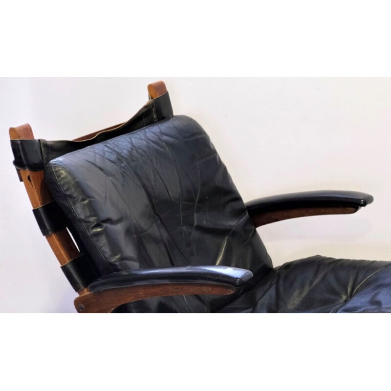 Vintage armchair Elsa &Nordahl Solheim and its ottoman for Rybo Rykken &Co in black leather 1960