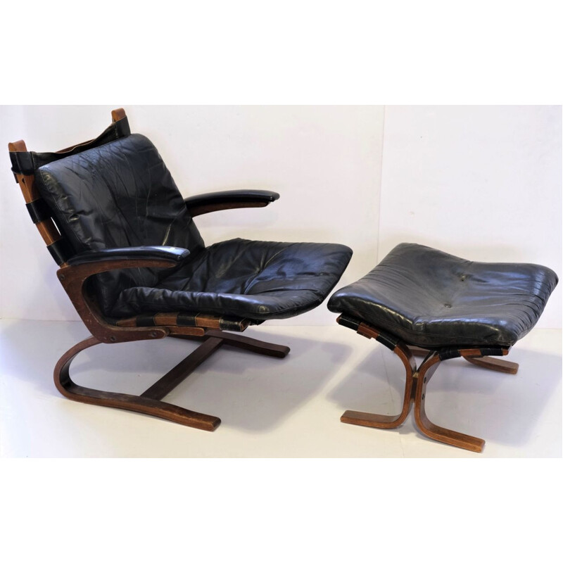 Vintage armchair Elsa &Nordahl Solheim and its ottoman for Rybo Rykken &Co in black leather 1960