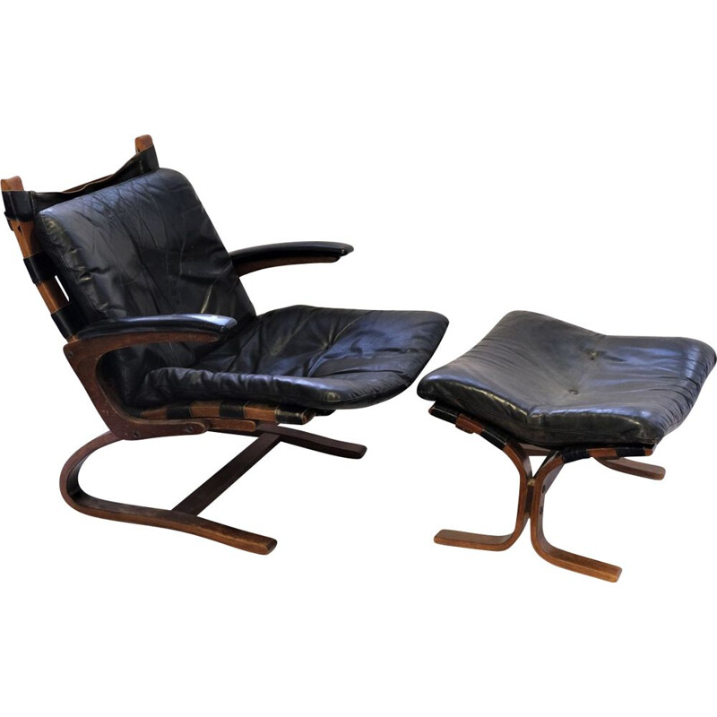 Vintage armchair Elsa &Nordahl Solheim and its ottoman for Rybo Rykken &Co in black leather 1960