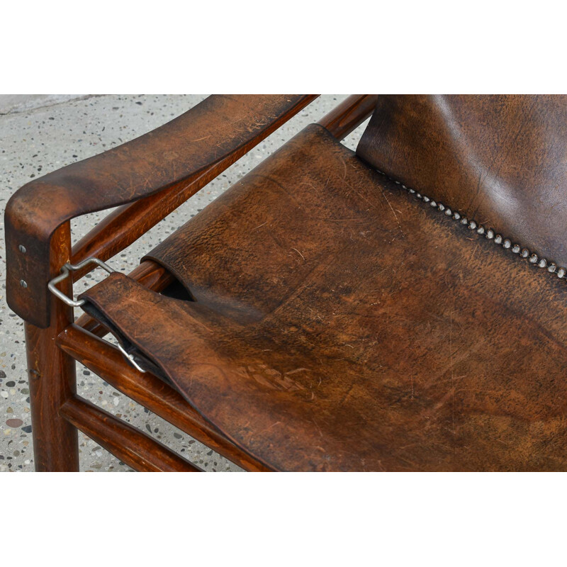 Fauteuil lounge vintage avec tabouret Safari en cuir