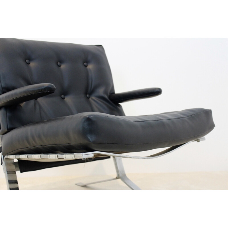 Mid Century armchair in black leatherette and chromed steel 1970s