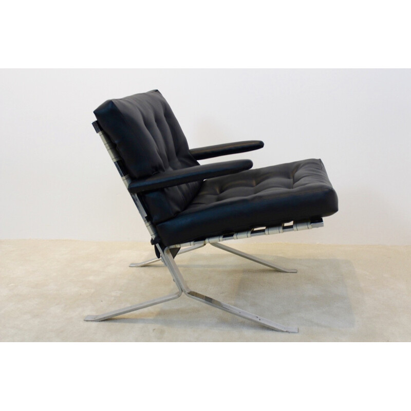 Mid Century armchair in black leatherette and chromed steel 1970s