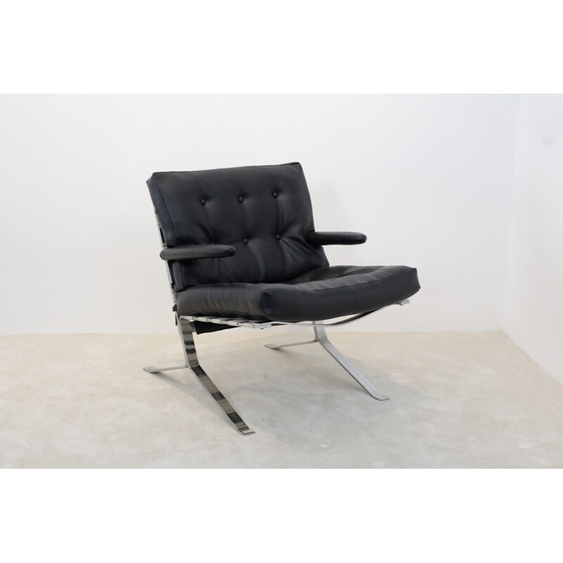 Mid Century armchair in black leatherette and chromed steel 1970s