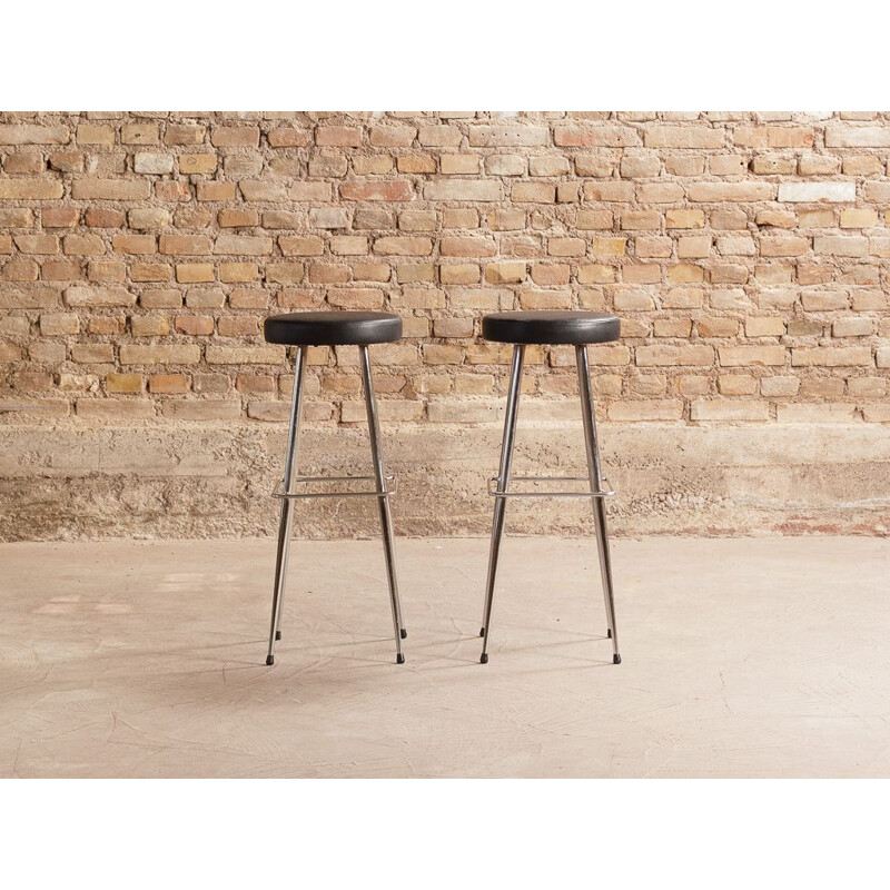 Pair of vintage stools in black imitation leather and chromed steel legs