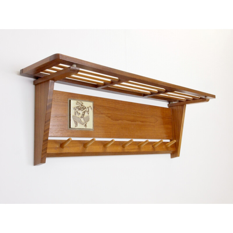 Mid century teak wooden wall mount coat rack decorated with a Jaap Ravelli ceramic tile Dutch