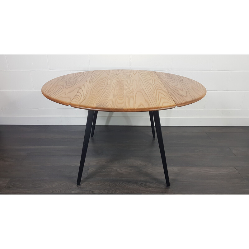 Vintage Round Drop Leaf Dining Table Ercol Black Leg, 1960s