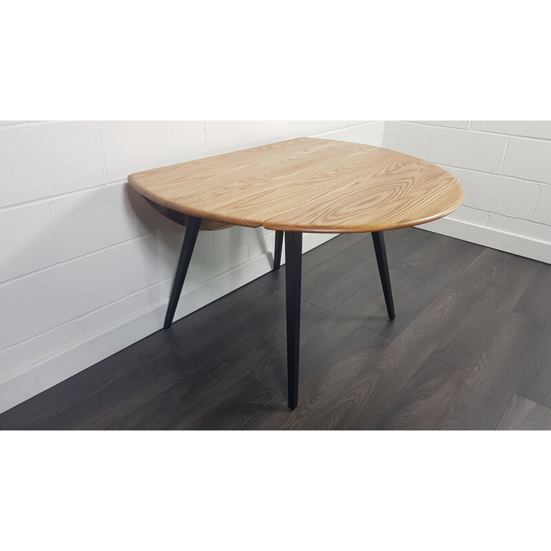 Vintage Round Drop Leaf Dining Table Ercol Black Leg, 1960s