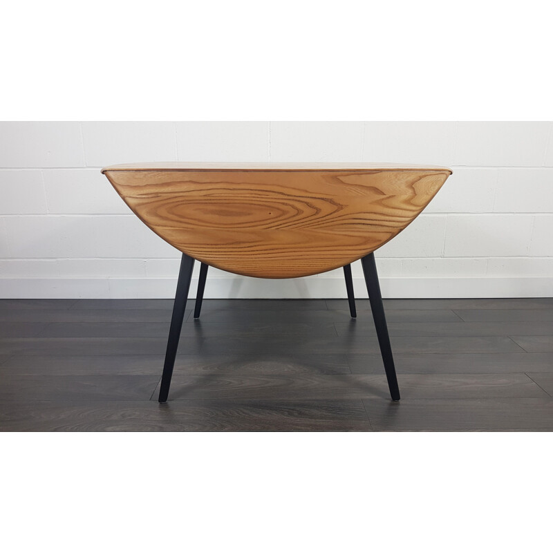 Vintage Round Drop Leaf Dining Table Ercol Black Leg, 1960s