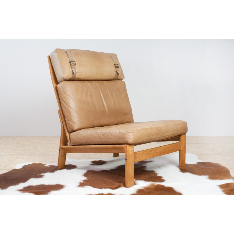 Vintage Danish leather and oak lounge chair by Komfort 1960s