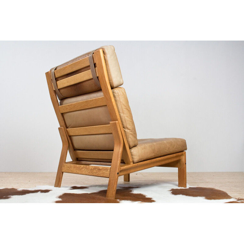 Vintage Danish leather and oak lounge chair by Komfort 1960s