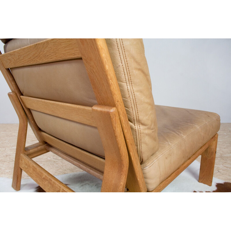 Vintage Danish leather and oak lounge chair by Komfort 1960s