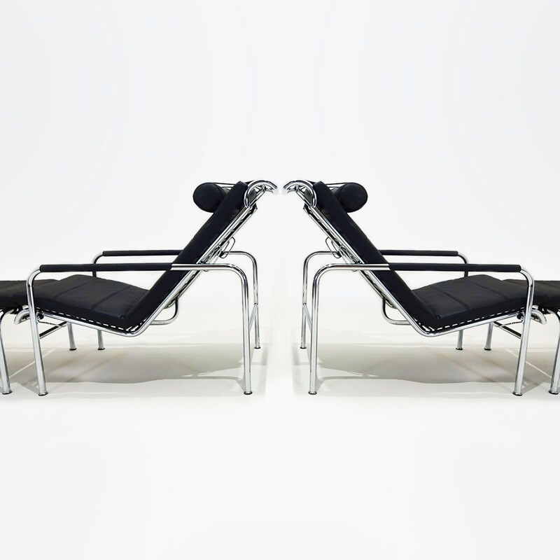 Pair of vintage black leather Genni reclining lounge chairs and ottomans by Gabriele Mucchi