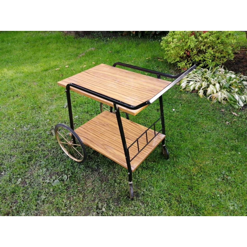 Vintage Bar table on wheels in a with a shelf