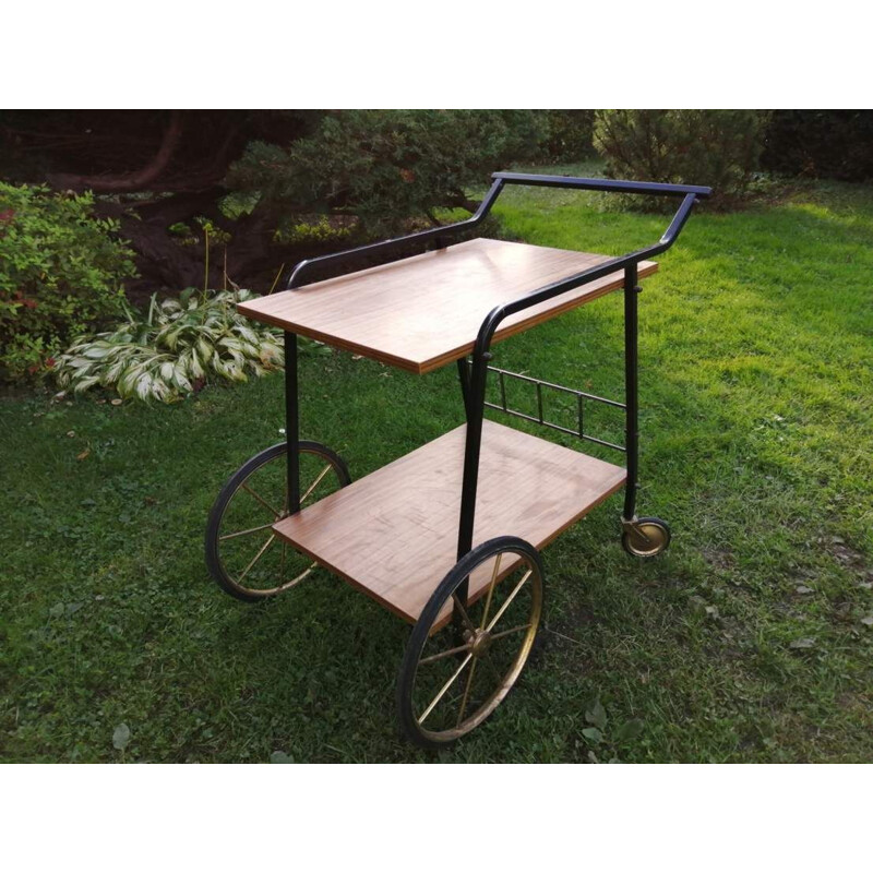 Vintage Bar table on wheels in a with a shelf