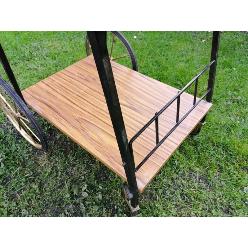 Vintage Bar table on wheels in a with a shelf