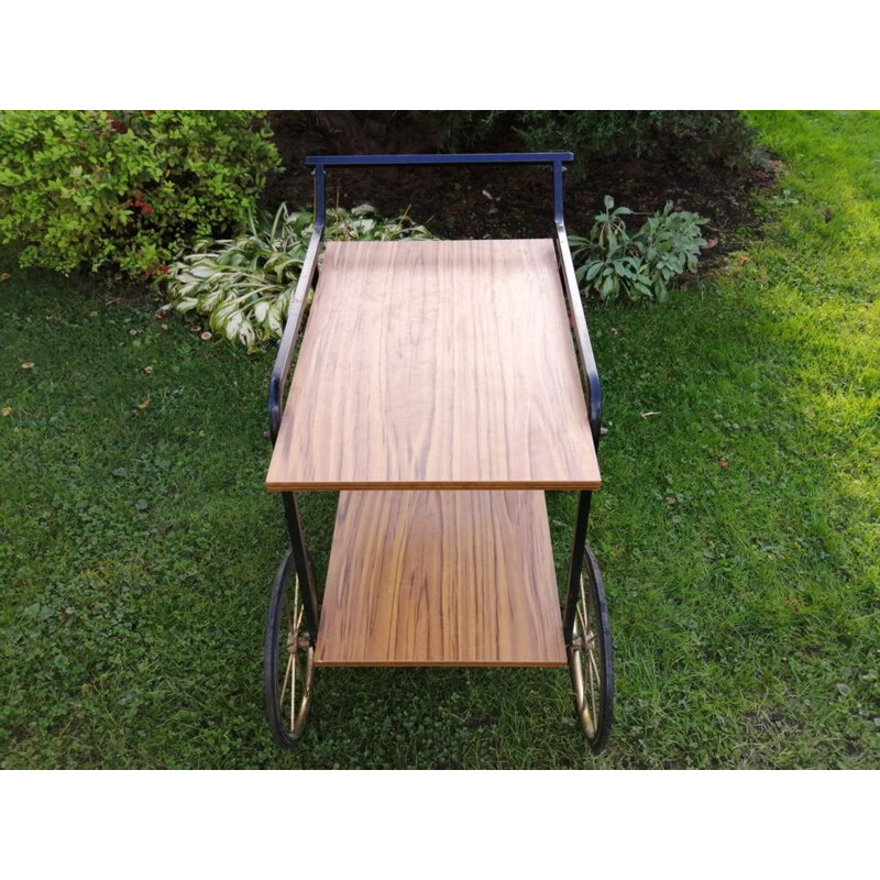 Vintage Bar table on wheels in a with a shelf