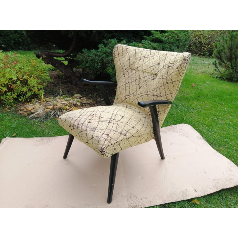 Vintage armchair on straight legs