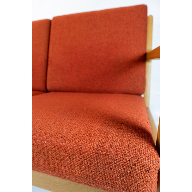 Vintage 3-seater sofa in oak and red wool fabric by Hans J. Wegner and Getama 1960