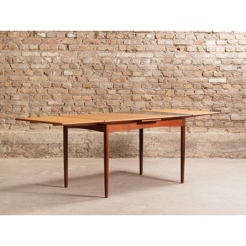 Vintage Danish dining table in solid teak with 2 integrated extensions