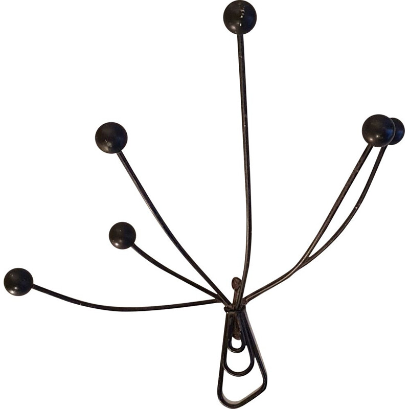 Vintage wall-mounted coat rack in metal and wooden balls