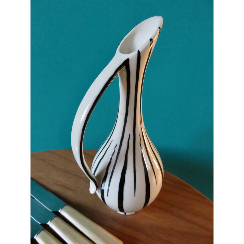 https://www.design-market.eu/1408398-large_default/lot-de-10-couteaux-vintage-avec-vase-en-ceramique-et-resine-france-1950.jpg