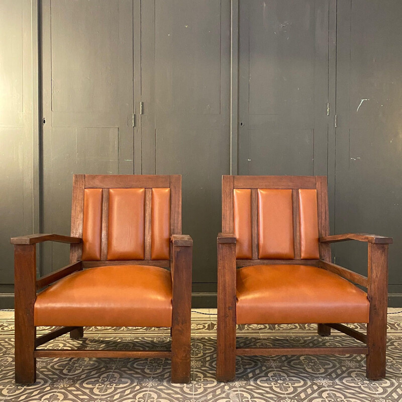 Pair of vintage colonial gold leather armchairs, France 1944