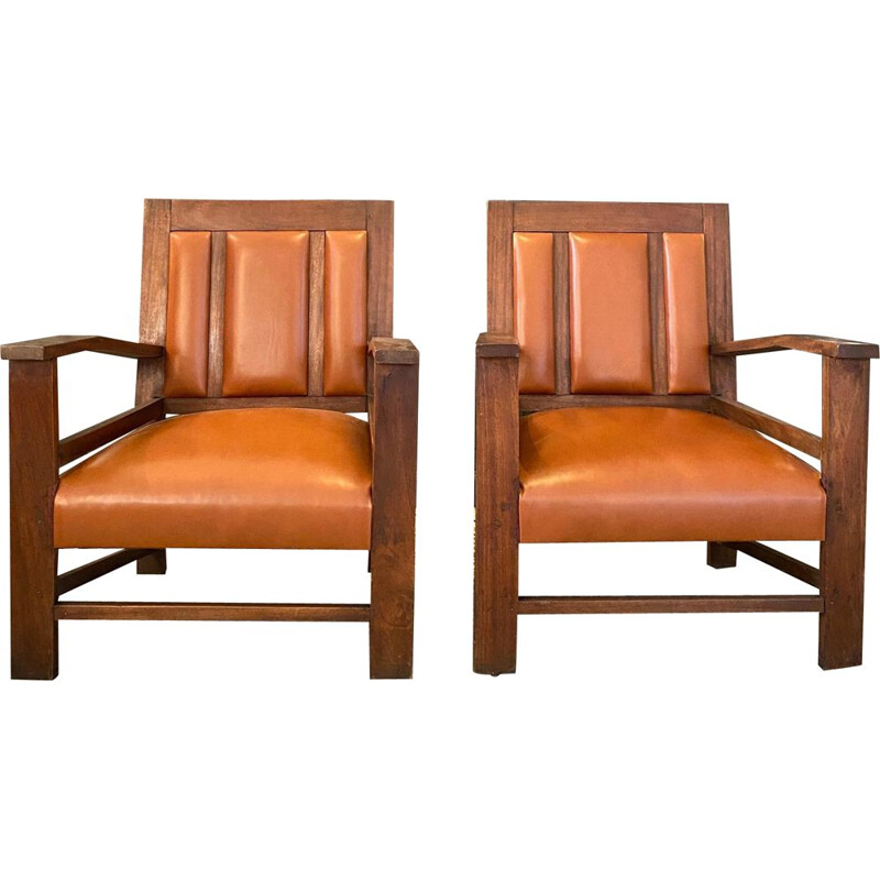 Pair of vintage colonial gold leather armchairs, France 1944