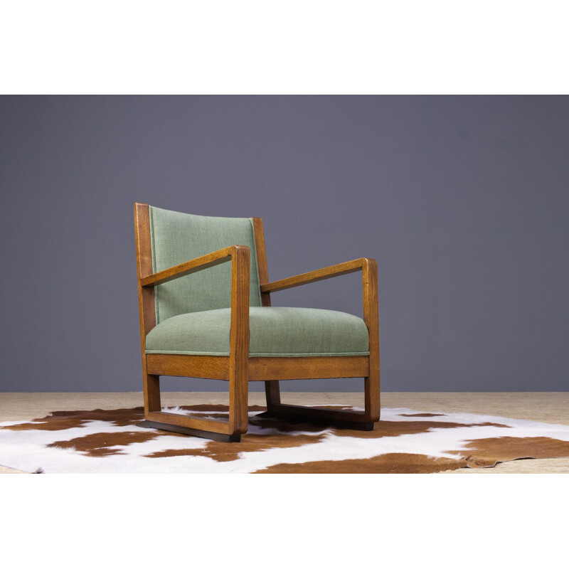 Vintage armchair in oak and green fabric