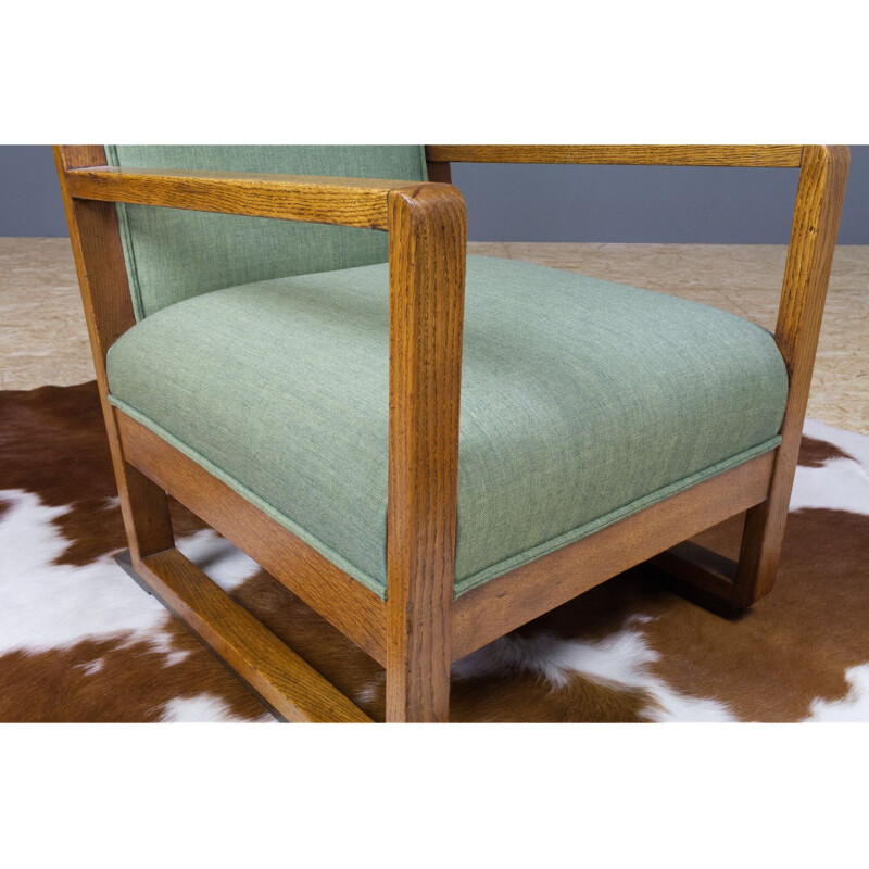 Vintage armchair in oak and green fabric