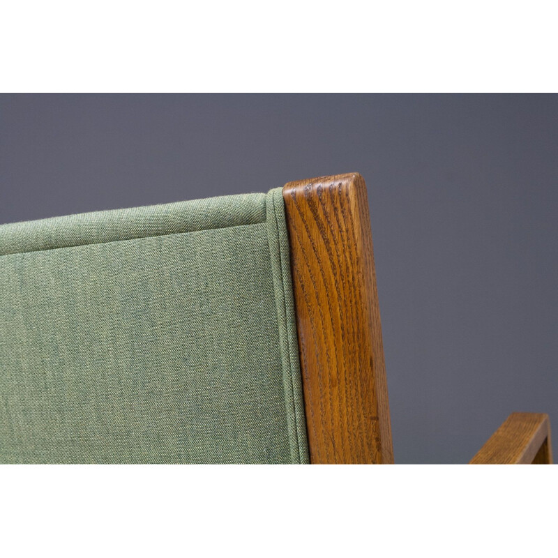 Vintage armchair in oak and green fabric