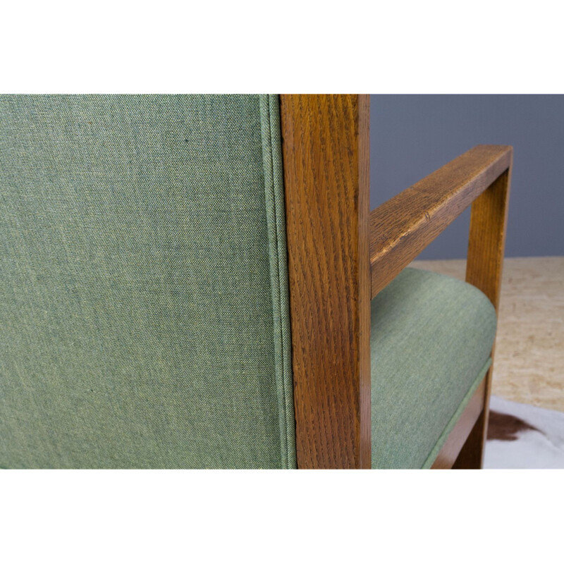 Vintage armchair in oak and green fabric